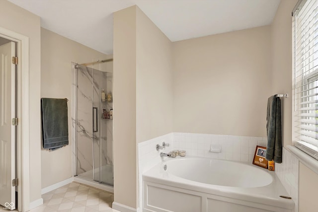 6624 Lakestone Ct, Indianapolis, IN 46237 - full bathroom featuring a bath, a marble finish shower, plenty of natural light, and baseboards
