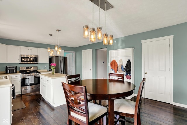 6624 Lakestone Ct, Indianapolis, IN 46237 - dining space featuring a chandelier, dark wood-style flooring, and baseboards