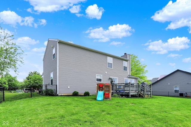 6624 Lakestone Ct, Indianapolis, IN 46237 - back of house featuring a chimney, a wooden deck, and cooling unit