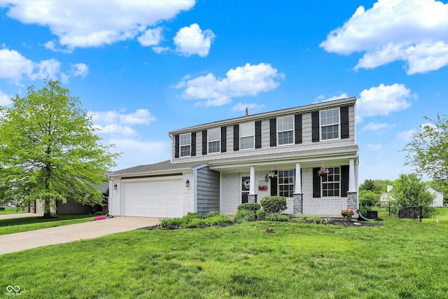 6624 Lakestone Ct, Indianapolis, IN 46237 - view of front of house featuring concrete driveway, brick siding, a front yard, covered porch, and a garage