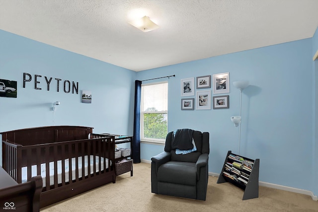 6624 Lakestone Ct, Indianapolis, IN 46237 - carpeted bedroom featuring a textured ceiling, baseboards, and a crib