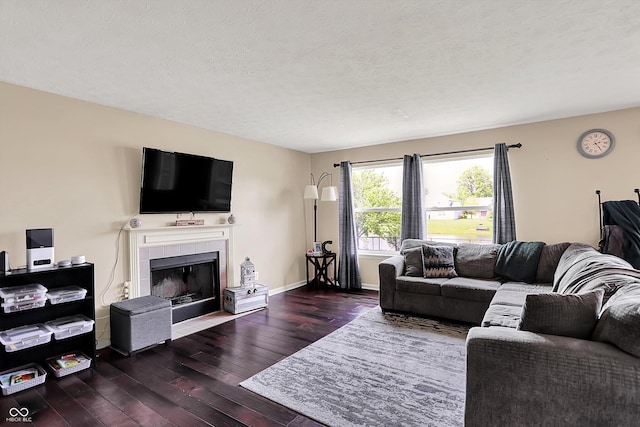 6624 Lakestone Ct, Indianapolis, IN 46237 - living area with wood-type flooring, a tile fireplace, and baseboards