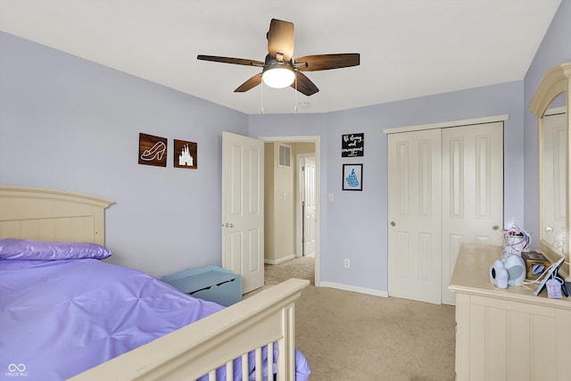 6624 Lakestone Ct, Indianapolis, IN 46237 - bedroom with light carpet, a closet, a ceiling fan, and baseboards
