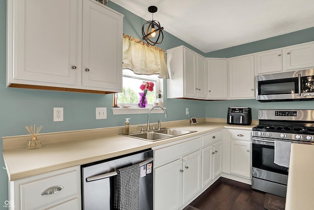 6624 Lakestone Ct, Indianapolis, IN 46237 - kitchen with appliances with stainless steel finishes, a sink, white cabinets, and light countertops
