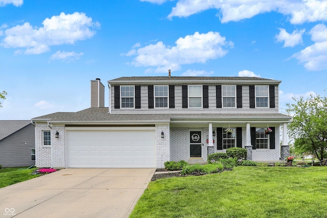 6624 Lakestone Ct, Indianapolis, IN 46237 - view of front of house with brick siding, concrete driveway, a front yard, a garage, and a chimney