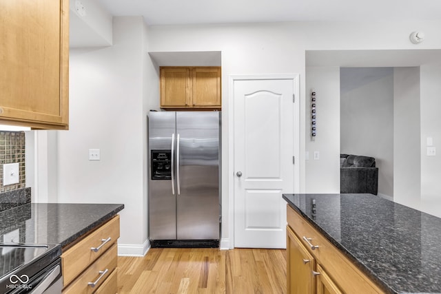 952 Junction Pl, Indianapolis, IN 46220 - kitchen featuring stainless steel fridge, light wood finished floors, dark stone countertops, baseboards, and range with electric stovetop