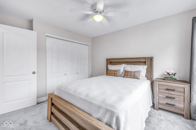 952 Junction Pl, Indianapolis, IN 46220 - bedroom with light carpet, a closet, and a ceiling fan