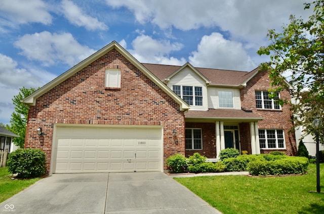 view of front of home featuring driveway, brick siding, a front yard, and an attached garage