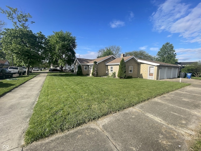 view of property exterior featuring a chimney, a lawn, an attached garage, concrete driveway, and stone siding
