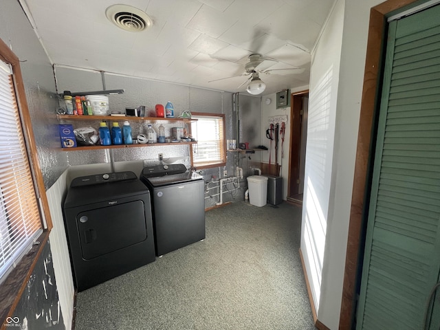 clothes washing area featuring washing machine and dryer, carpet, ceiling fan, visible vents, and laundry area