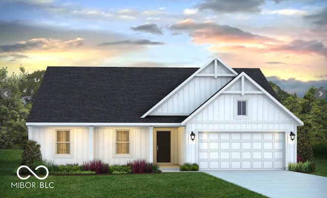 modern farmhouse style home featuring a shingled roof, board and batten siding, a yard, and concrete driveway