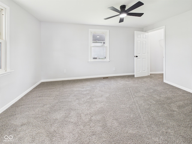 225 S Carthage Rd, Charlottesville, IN 46117 - unfurnished bedroom with carpet, baseboards, and a ceiling fan
