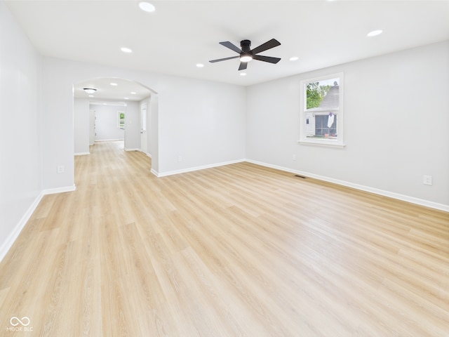 225 S Carthage Rd, Charlottesville, IN 46117 - unfurnished room with ceiling fan, recessed lighting, arched walkways, light wood-style floors, and baseboards