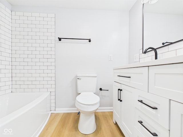 225 S Carthage Rd, Charlottesville, IN 46117 - full bathroom featuring wood finished floors, toilet, vanity, baseboards, and  shower combination