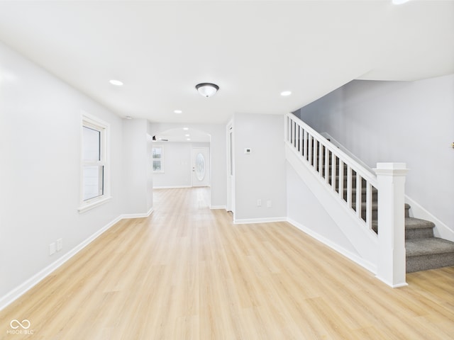 225 S Carthage Rd, Charlottesville, IN 46117 - interior space featuring stairs, arched walkways, light wood-type flooring, baseboards, and recessed lighting