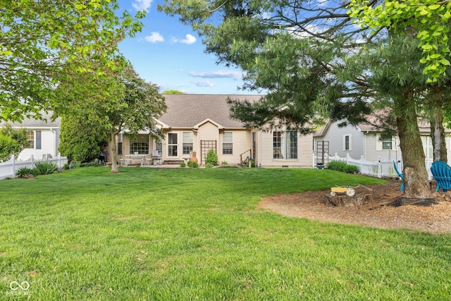 rear view of house featuring a shingled roof and a patio area