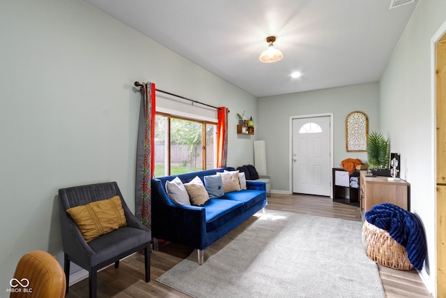 living room with wood finished floors and baseboards