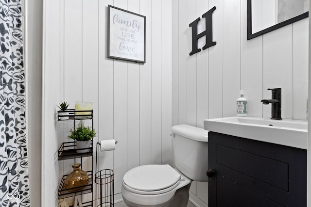bathroom with toilet and vanity