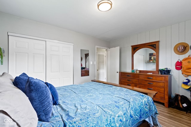 bedroom featuring wood finished floors and a closet