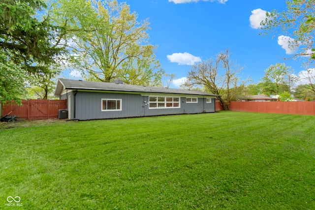 rear view of house featuring central AC unit