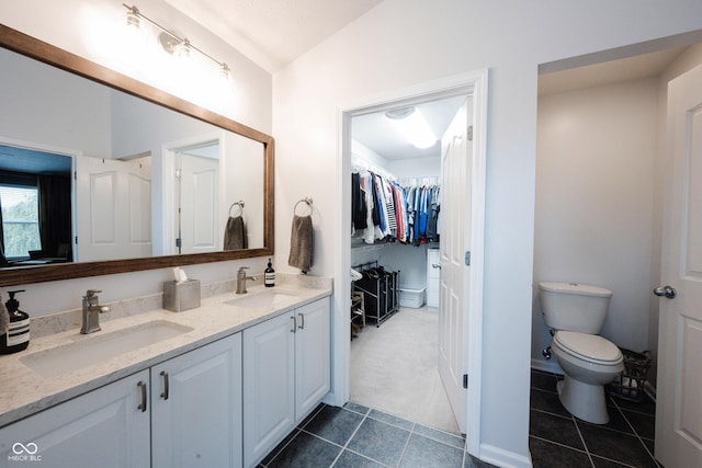 14030 Avalon E Dr, Fishers, IN 46037 - bathroom with double vanity, tile patterned flooring, toilet, and a walk in closet