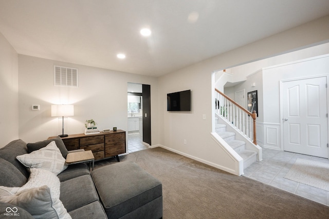 14030 Avalon E Dr, Fishers, IN 46037 - tiled living room featuring stairs, a sink, recessed lighting, carpet floors, and baseboards