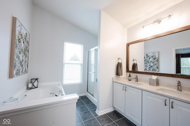 14030 Avalon E Dr, Fishers, IN 46037 - full bath with a stall shower, double vanity, a garden tub, lofted ceiling, and tile patterned flooring