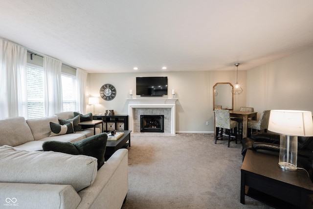14030 Avalon E Dr, Fishers, IN 46037 - carpeted living room with a tile fireplace, baseboards, and recessed lighting