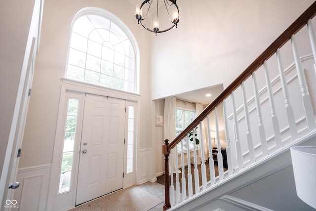 14030 Avalon E Dr, Fishers, IN 46037 - foyer entrance featuring stairway, a chandelier, and a high ceiling