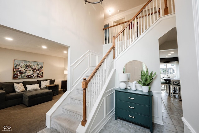 14030 Avalon E Dr, Fishers, IN 46037 - staircase featuring a towering ceiling, recessed lighting, and tile patterned flooring