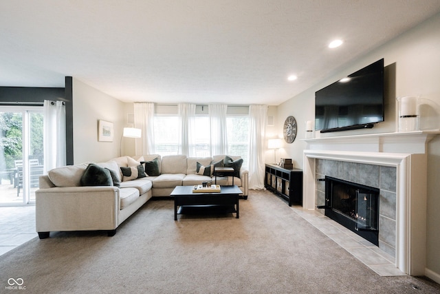 14030 Avalon E Dr, Fishers, IN 46037 - living room with light colored carpet, a fireplace, and recessed lighting