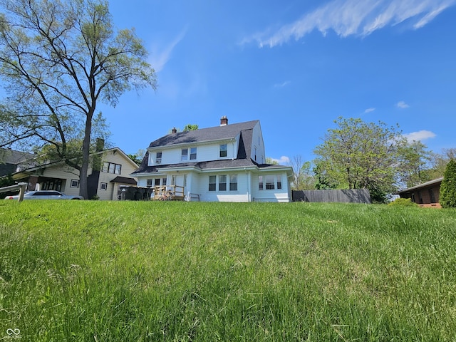 1222 Nichol Ave, Anderson, IN 46016 - back of house featuring a chimney and fence