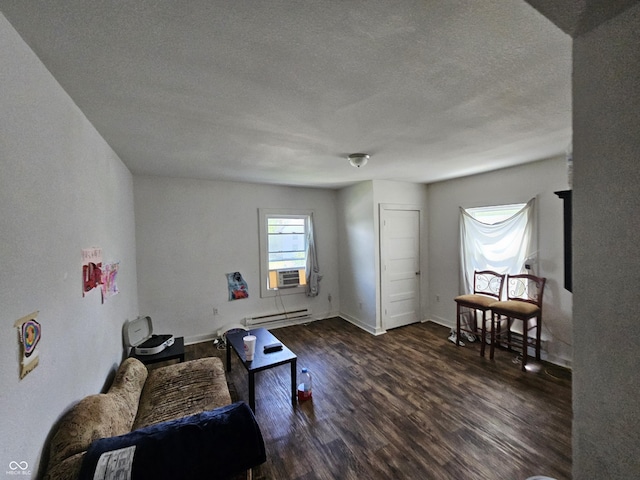 1222 Nichol Ave, Anderson, IN 46016 - sitting room featuring a baseboard heating unit, wood finished floors, a textured ceiling, and baseboards
