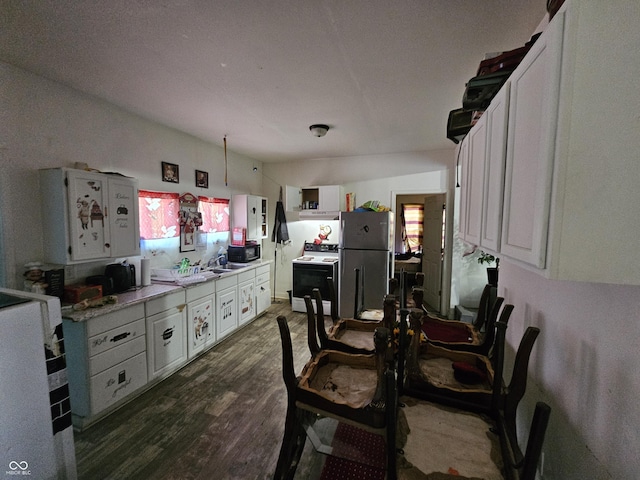 1222 Nichol Ave, Anderson, IN 46016 - dining room featuring dark wood-style floors and healthy amount of natural light