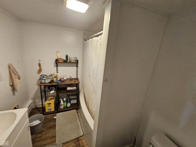 1222 Nichol Ave, Anderson, IN 46016 - bathroom featuring wood finished floors, toilet, and a shower with curtain