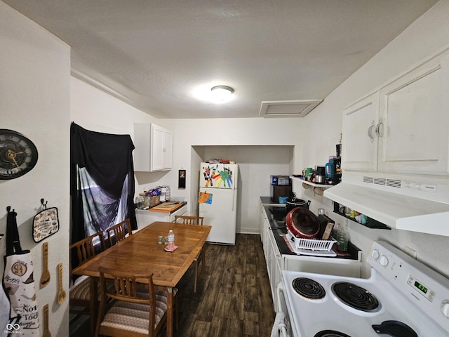 1222 Nichol Ave, Anderson, IN 46016 - kitchen featuring white appliances, extractor fan, dark wood-type flooring, white cabinets, and light countertops