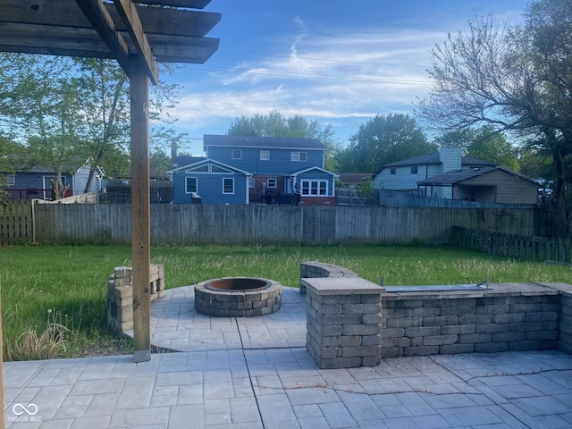view of patio featuring a fire pit and a fenced backyard