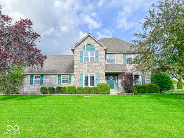 8798 Surrey Dr, Pendleton, IN 46064 - view of front of property featuring brick siding, a front yard, and a shingled roof