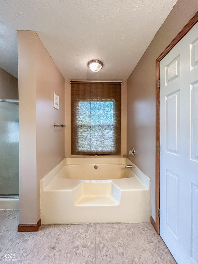 8798 Surrey Dr, Pendleton, IN 46064 - bathroom featuring a bath and baseboards