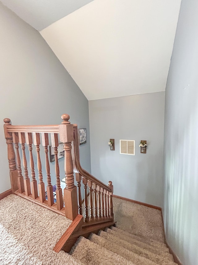 8798 Surrey Dr, Pendleton, IN 46064 - stairs with carpet, baseboards, and vaulted ceiling