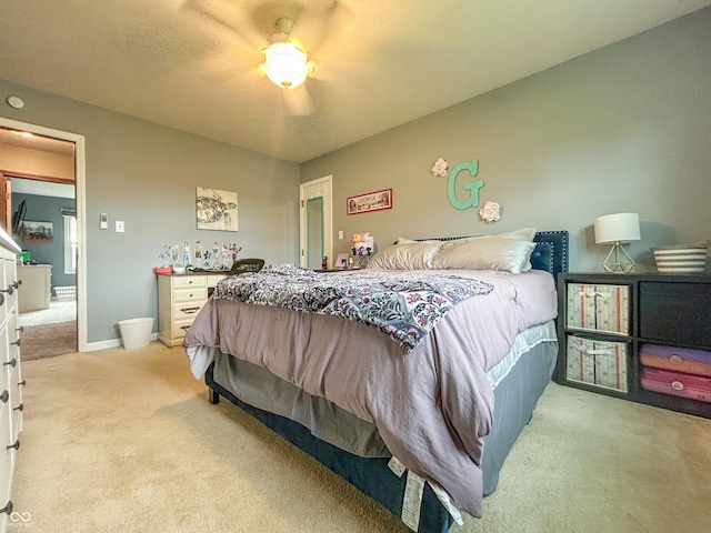 8798 Surrey Dr, Pendleton, IN 46064 - bedroom featuring light carpet, ceiling fan, and baseboards