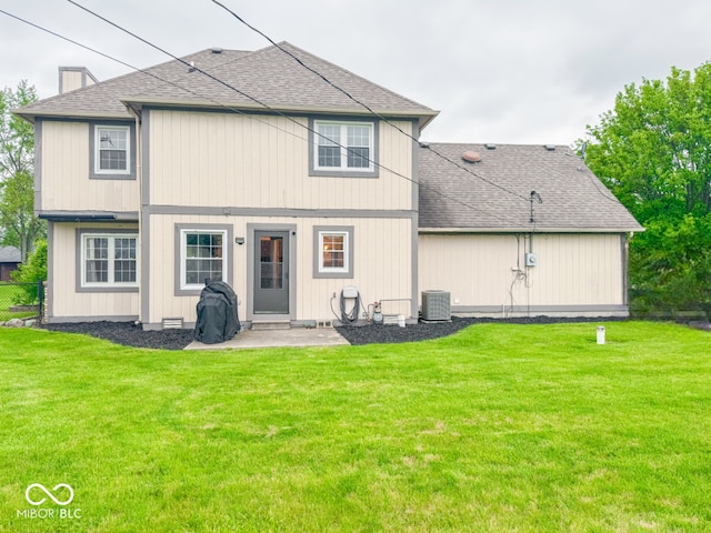 8798 Surrey Dr, Pendleton, IN 46064 - rear view of property featuring a shingled roof, cooling unit, and a patio area