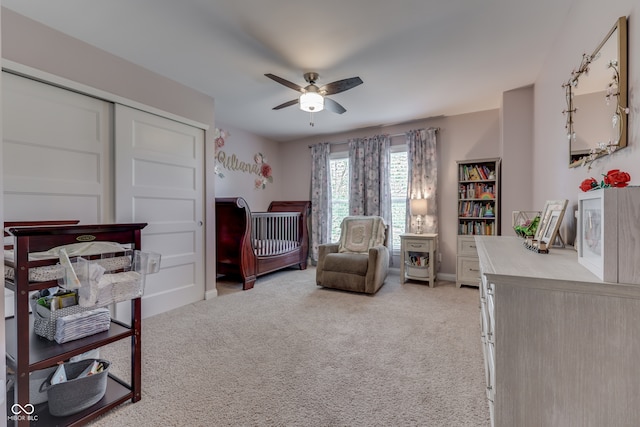 1476 Anon Ct, Greenwood, IN 46143 - bedroom with light colored carpet, a ceiling fan, a closet, and baseboards