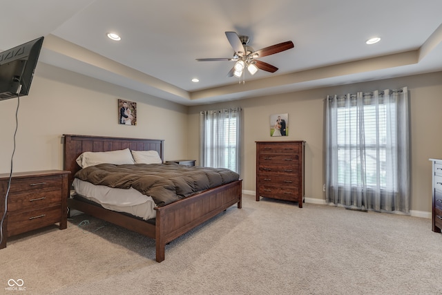1476 Anon Ct, Greenwood, IN 46143 - bedroom featuring light colored carpet, recessed lighting, baseboards, a tray ceiling, and a ceiling fan