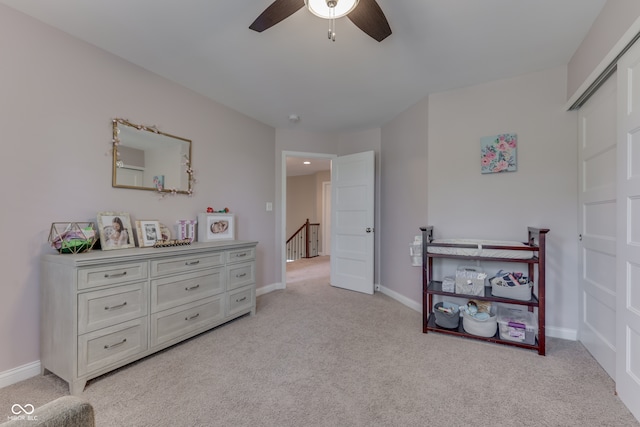 1476 Anon Ct, Greenwood, IN 46143 - bedroom with light colored carpet, baseboards, and ceiling fan
