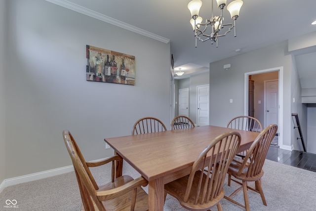 1476 Anon Ct, Greenwood, IN 46143 - dining room featuring carpet floors, a chandelier, baseboards, and ornamental molding