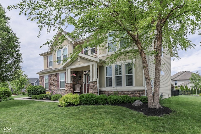 1476 Anon Ct, Greenwood, IN 46143 - craftsman-style home with stone siding, a front yard, and stucco siding