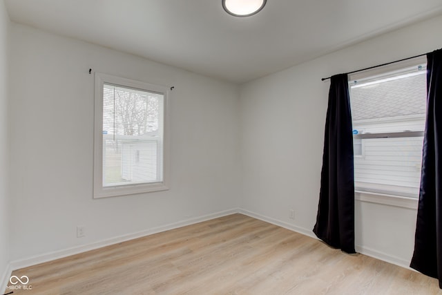 1517 Wallace Ave, Indianapolis, IN 46201 - spare room with baseboards and light wood-style floors