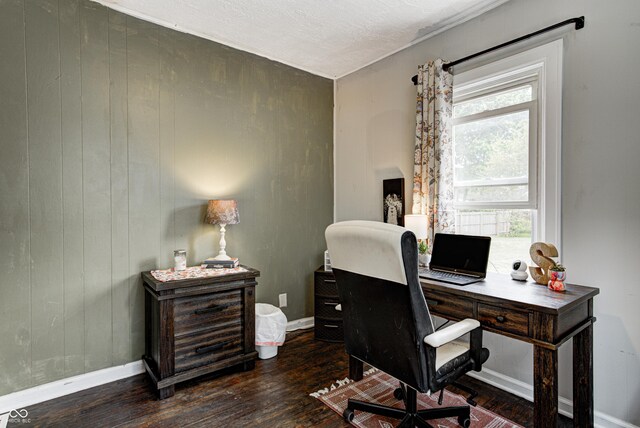 office space featuring baseboards and wood finished floors