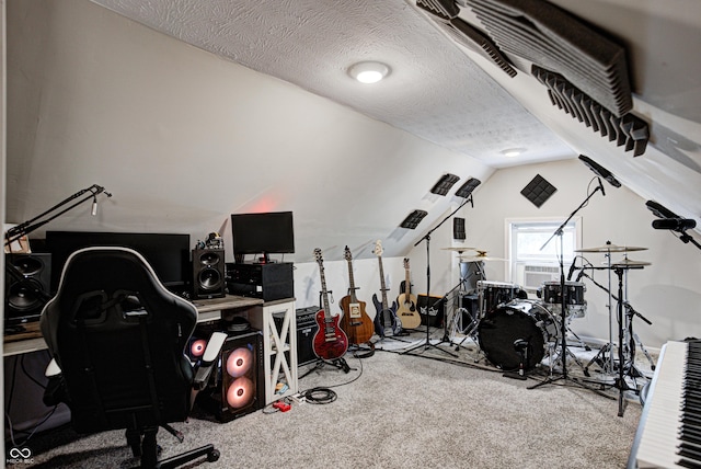 game room with lofted ceiling, a textured ceiling, and carpet